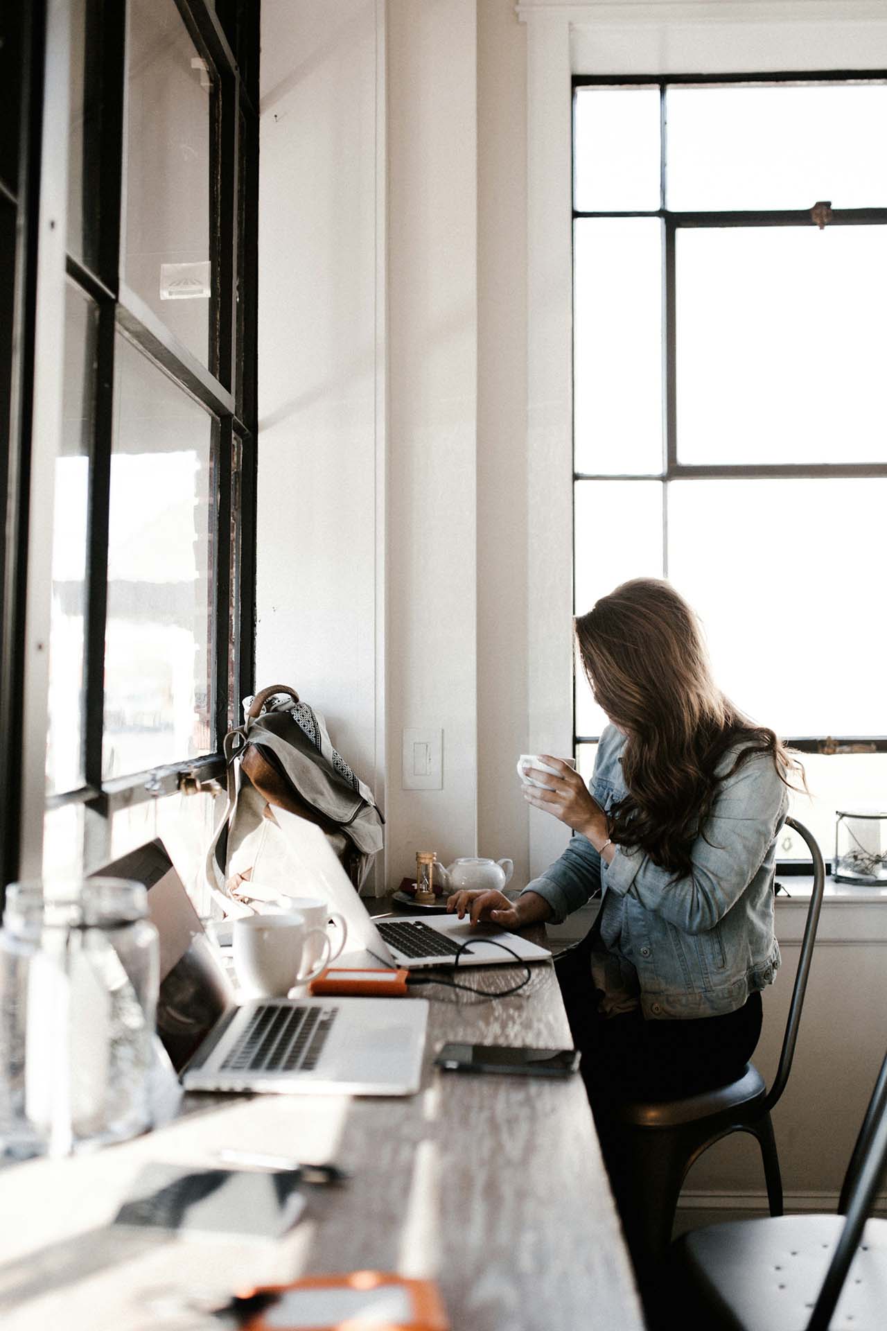 woman working and drinking coffee